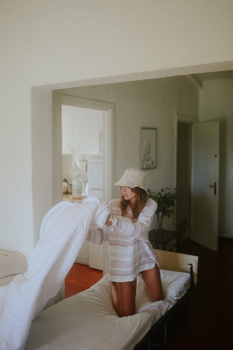 Tizia wears our Linen Bucket Hat in Sand
